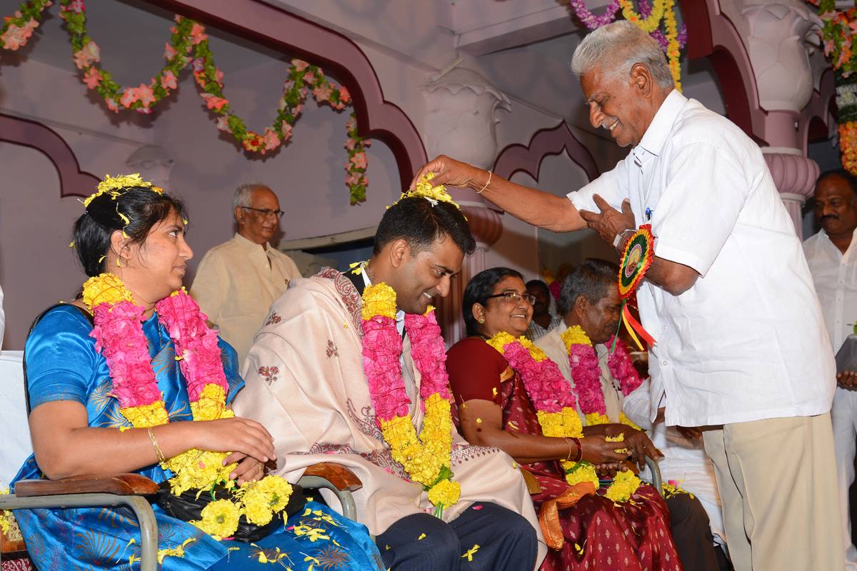 Kishore and his family being felicitated by his alma mater
